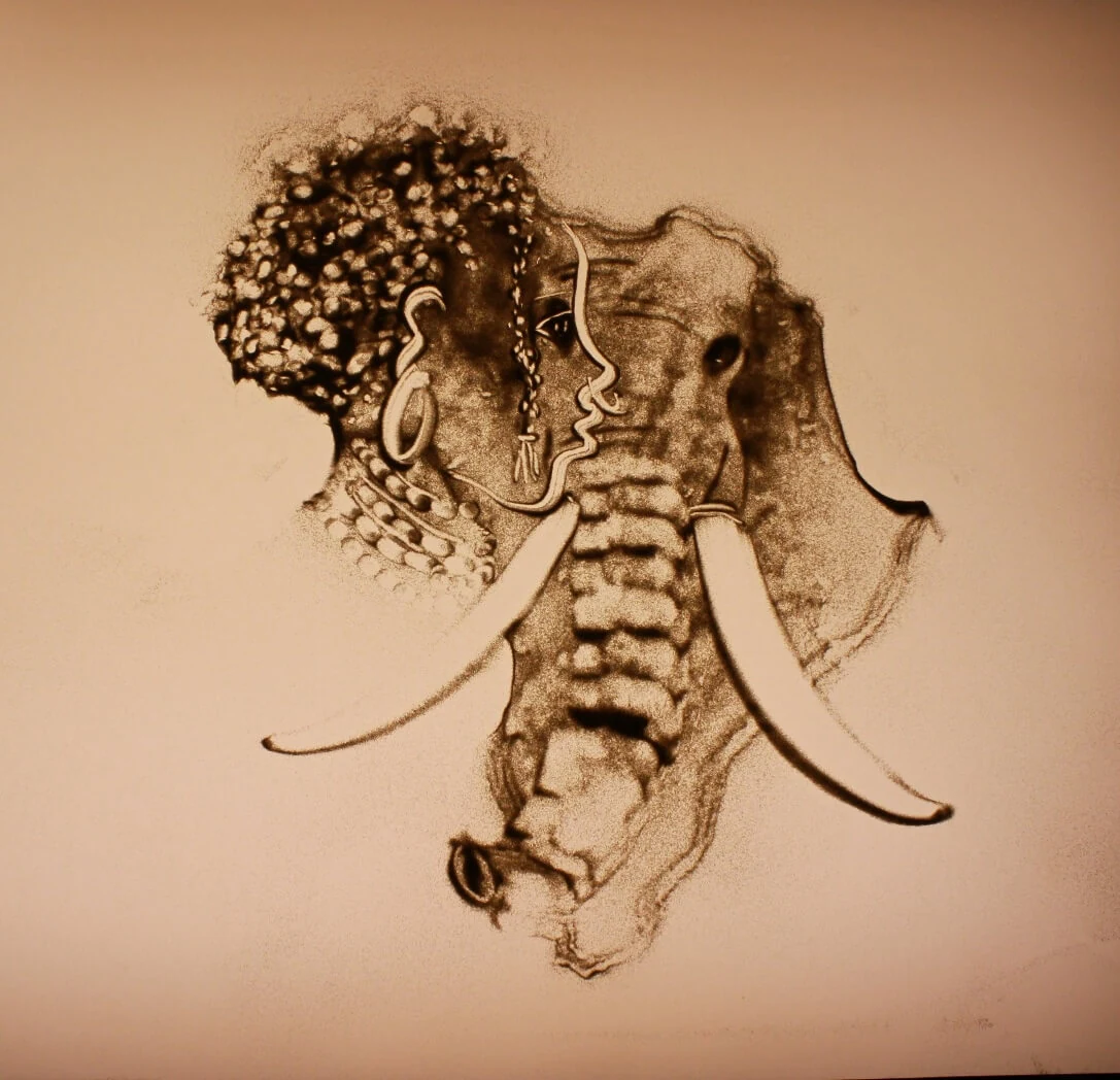 Sand drawing of an elephant and tree