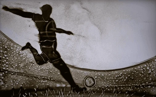 Sand drawing about human perseverance